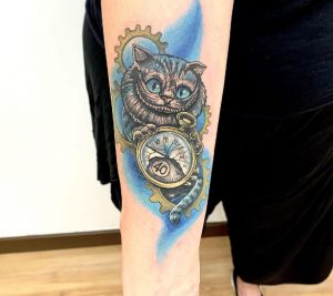 4 Amazing Color Ink Cute Cat Holding Mythical Watch in Hand Gear Tattoo Drawing on Forearm
