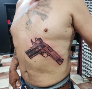 4 Stunning Color Inked 1911 Pistol Tattoo Bellow Chest