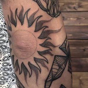 linework Sunburst Tattoo on Elbow