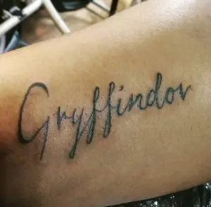 40 Only Gryffindor Written Tattoo on Hand