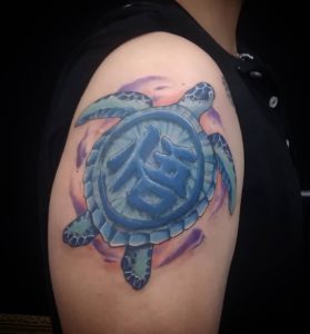 43 Blue Ink Kanji Tattoo in Turtle on Arm