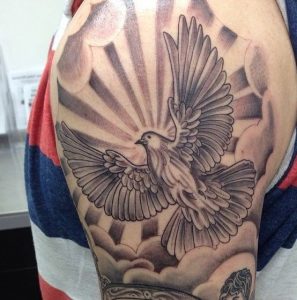 Amazing Sunburst Tattoo with Flying bird in the Clouds on Arm