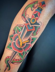 5 Beautiful Color Inked Knife with in Flower Tattoo on Lower leg