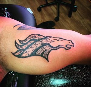 Black Broncos Arm Tattoo