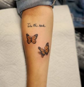 5 Dark Inked Butterfly with Quote Tattoo for Pretty Female on Forearm