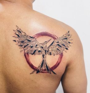 5 Legendery Black Line with Red Circle Ink Designed Best Hunger Games Mockingjay Bird Tattoo on Back