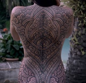 5 ornamental Body Suit Tattoo on full back
