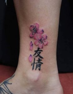 51 Pink Black Ink Kanji Tattoo on Leg