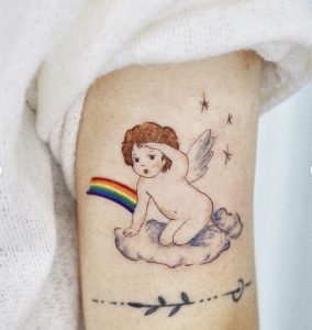 52 Baby on Cloud with Rainbow Tattoo on Sleeve