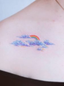 55 Rainbow with Clouds Tattoo on Chest