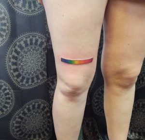 58 Single Rainbow Strip Tattoo on Thigh