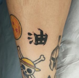 6 Dark Ink Kanji Tattoos on Leg