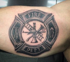 Gray color Fire Department Tattoo on the arm