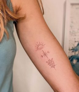 dot & fine line work Sunburst Tattoo over Ocean