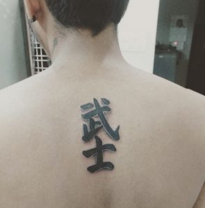 61 Black Ink Kanji Tattoo on Back