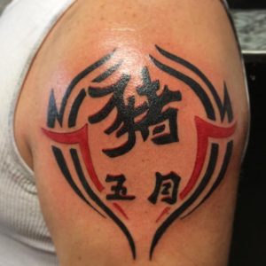 63 Black and Red Ink Kanji Tattoo on Half Arm