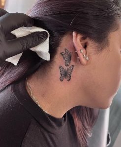 7 Black Color Small Butterflies Tattoo for Beautiful Girls on Behind the Ear