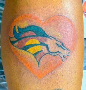 7 Lovely Colored Broncos Tattoo in Love Shape on Leg