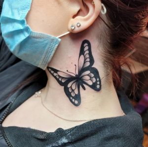 7 Outstanding Black Inked Big Butterfly Free to Fly Tattoo Meaning for Female on Side Neck and Bellow Ear