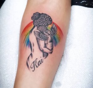 79 Angle Baby Mother with Rainbow Tattoo on Hand