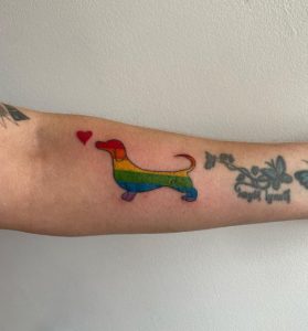 81 Lovely Rainbow Dog Tattoo on Forearm