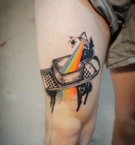 89 Puzzle Rainbow Tattoo on Thigh