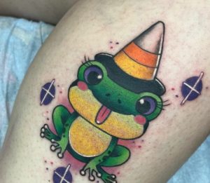 9 Cutest Multi Color Small Frog with Tiny Hat Tattoo Design on Leg