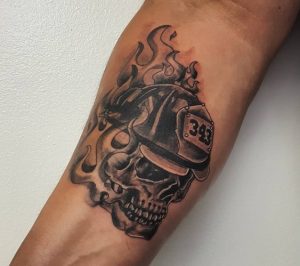 Incredible Fire Department skull Tattoo on forearm