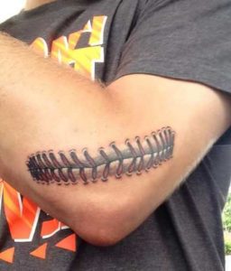 Baseball stitch tattoo on elbow 4