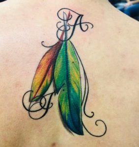 Parrot feather tattoo 4