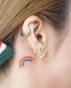 rainbow tattoo behind ear