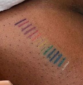 rainbow tattoo on dark skin