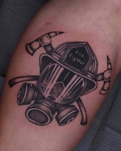 Black helmet fire department tattoo design