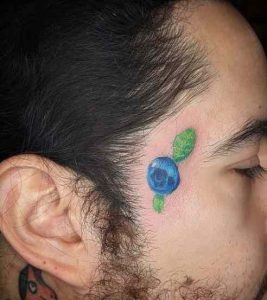 Blueberries with faces tattoo