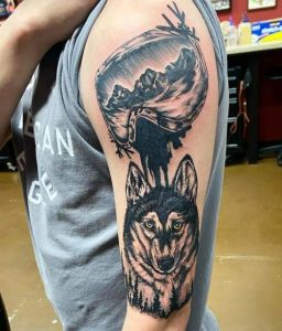 Wolf And Snowboard Tattoo