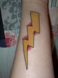 Yellow lightning bolt tattoo