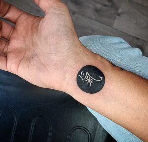 Black Circled Hand Tattoo