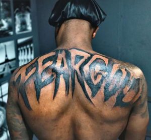 Fear God On Back Tattoo 
