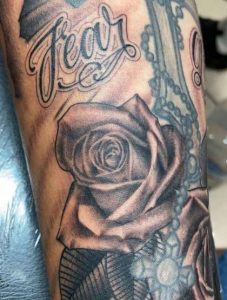 Rose With Fear God Tattoo