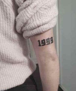 Forearm Tattoo Of 1999
