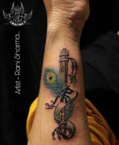 Peacock Flute And Feather Tattoo