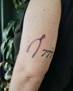 Wishbone With Number Tattoo