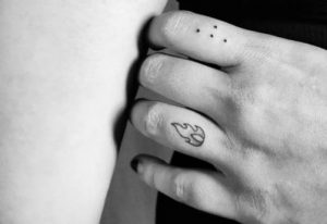 Braille finger tattoo with fire