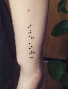 I am enough braille arm tattoo