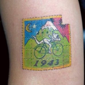 Traditional American design bicycle day tattoo