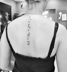 Braille spine tattoo black and white