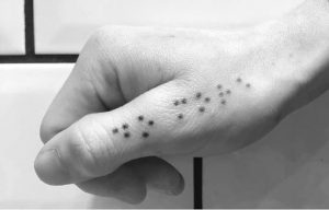Braille exclusive finger tattoo