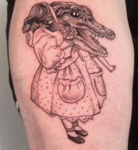 Alligator arm tattoo