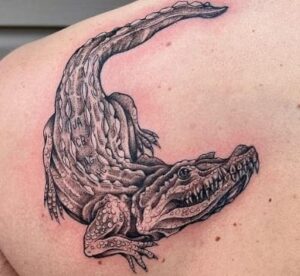 Alligator back tattoo
