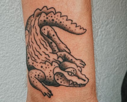 Alligator hand tattoo
